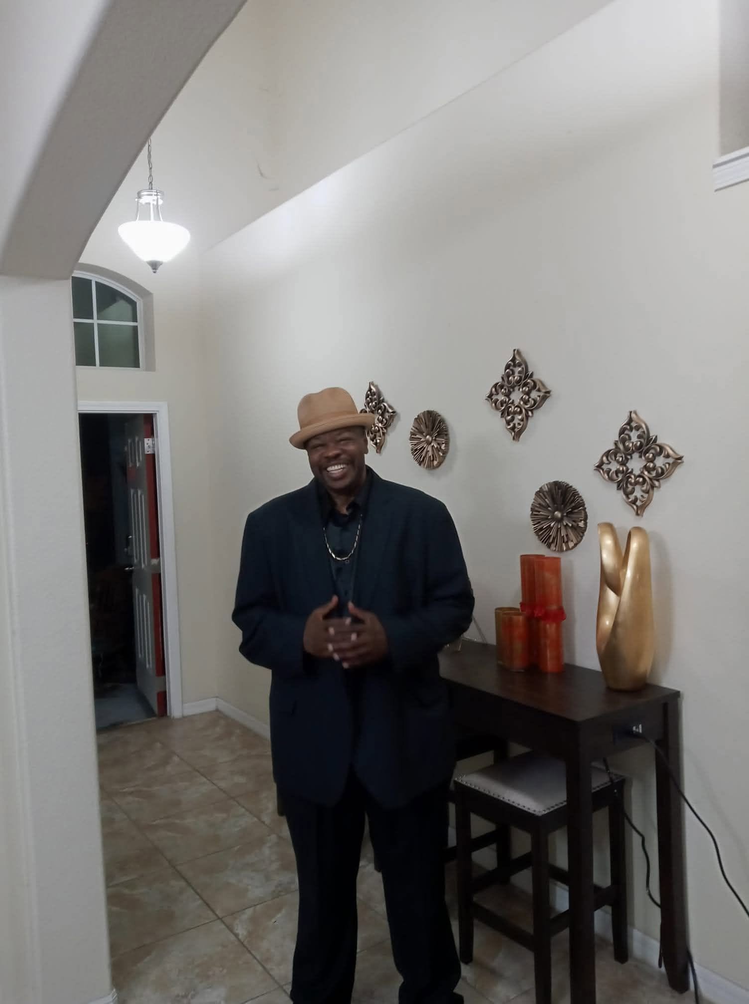 Bobby Vincent smiling in his home